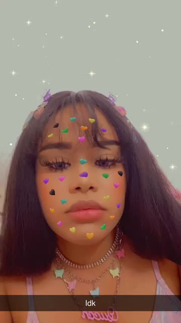 Preview for a Spotlight video that uses the Hearts Sticker💚💛 Lens