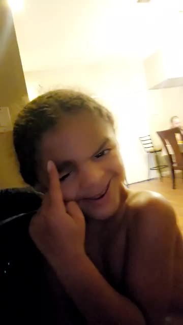 Preview for a Spotlight video that uses the Smirk Face Lens
