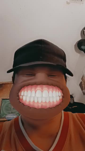Preview for a Spotlight video that uses the Grinning Face Lens