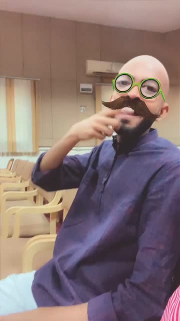 Preview for a Spotlight video that uses the Bald with glasses Lens
