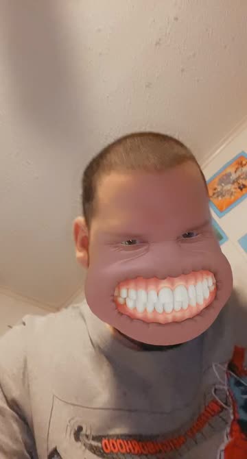 Preview for a Spotlight video that uses the Grinning Face Lens