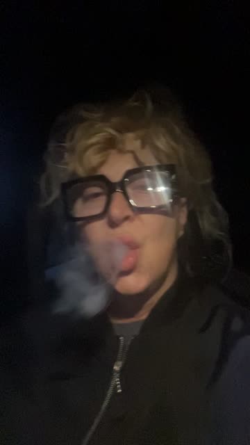 Phoebe's Nighttime Selfie: Glasses, Smoke & Candid Vibes