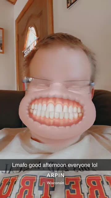 Preview for a Spotlight video that uses the Grinning Face Lens