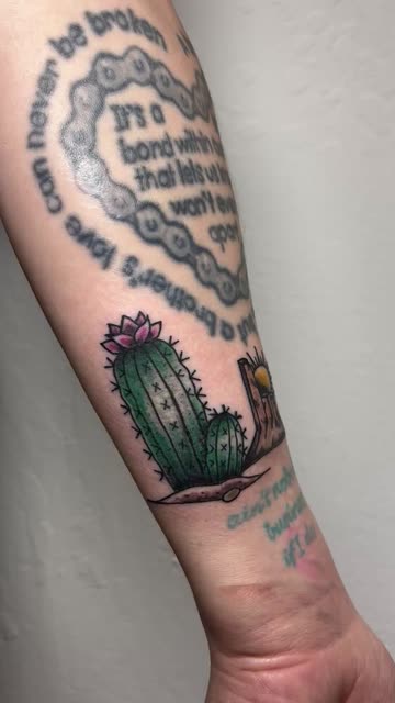 Tattoo Art Close-Up: Cactus, Heart Quote & Desert Scene