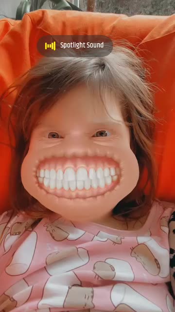 Preview for a Spotlight video that uses the Grinning Face Lens