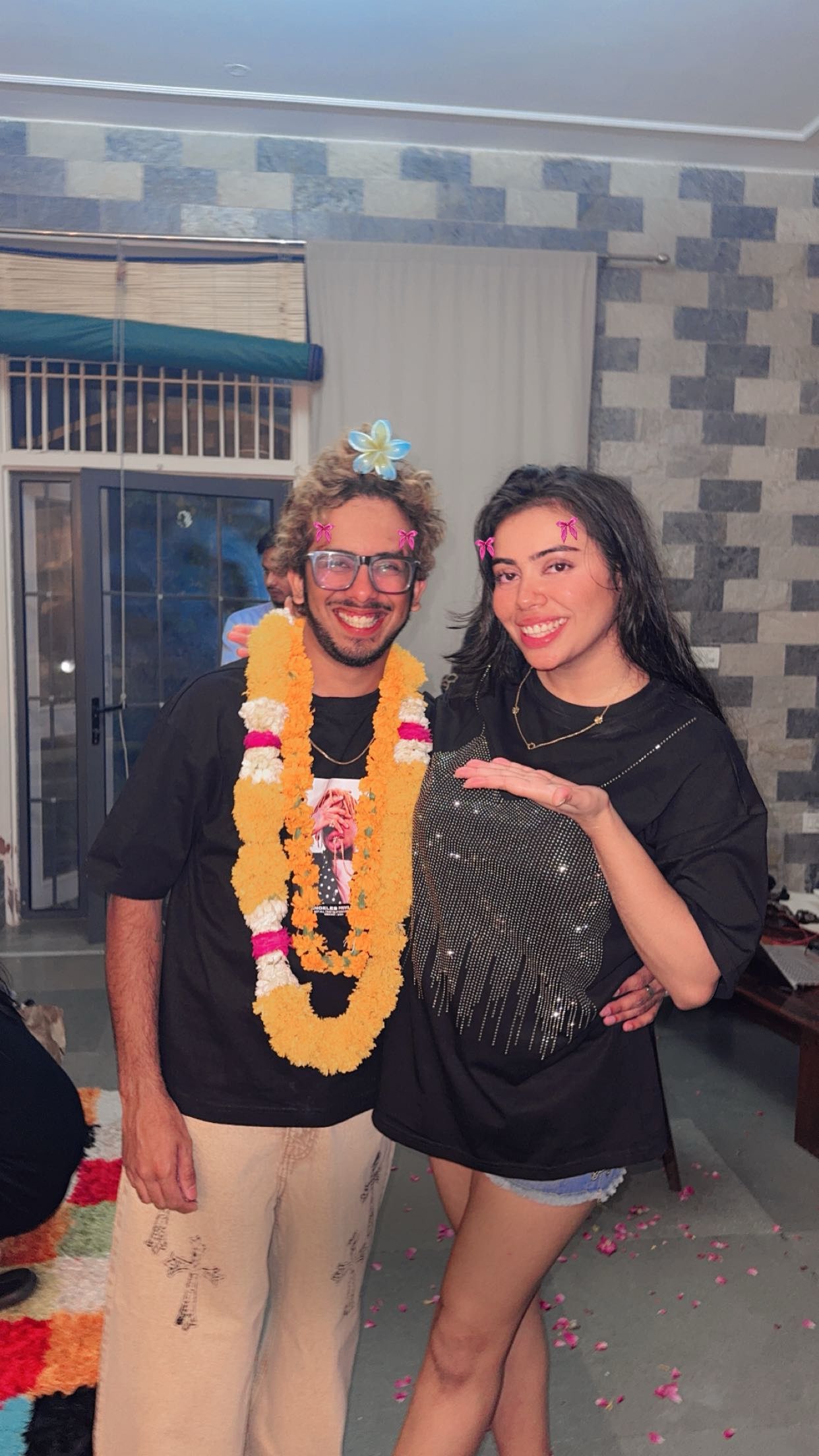 Missy Dexter Celebrates with Friend in Festive Outfit and Flower